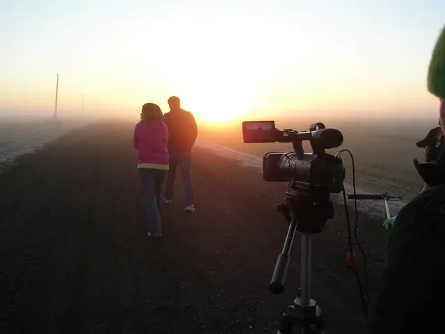 Filming on a foggy country road at sunrise